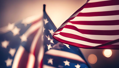 Two American flags waving in the wind, a symbol of freedom and patriotism.