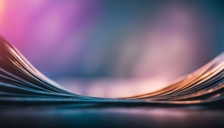 A close-up abstract image of a wave pattern created by lines. The background is blurred with a gradient of pink and blue.の写真素材