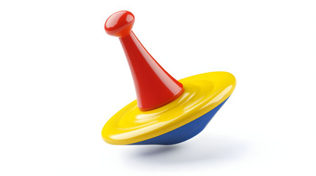 A vibrant spinning top toy in red, yellow and blue, isolated against a white background.の写真素材