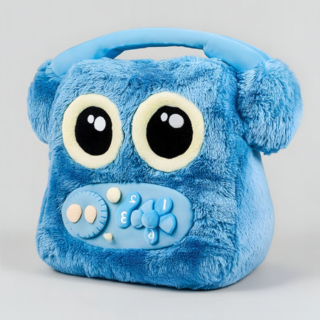 A charming blue plush toy shaped like a musical device. Perfect for young children.の写真素材