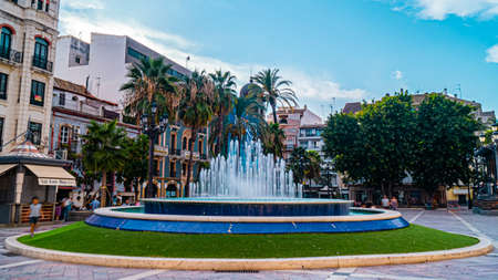 water fountain on a square in Huelvaの写真素材