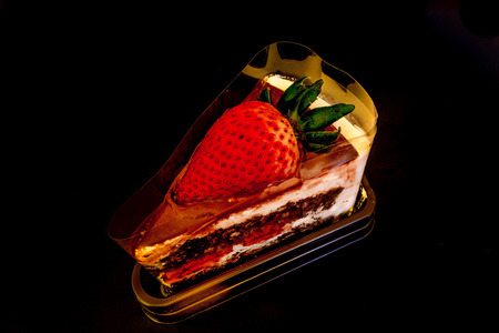 Piece of chocolate cake with fresh strawberryの写真素材