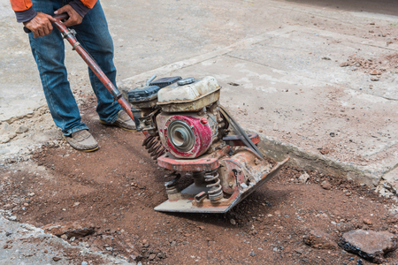 Workers on asphalting and repair of city streets
