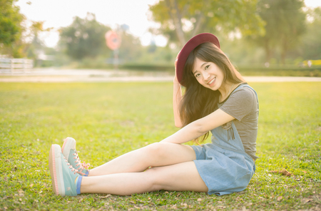 Portrait young woman smiling happy freedom in park with sunlightの写真素材