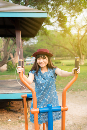 Beautiful muscular fit woman exercising building muscles in parkの写真素材