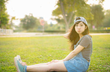 Portrait young woman smiling happy freedom in park with sunlightの写真素材