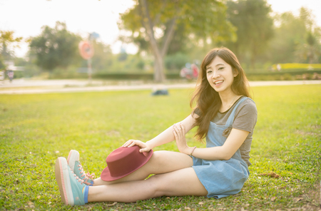 Portrait young woman smiling happy freedom in park with sunlightの写真素材