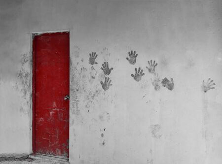 Red Door and Hand Prints on wall,Hand Print art on wall の写真素材