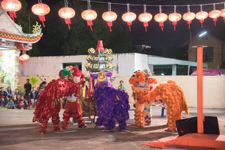Kalasin, Somdet - December 9, 2017 : Dragon and lion dance show in chinese new year festival t Somdet district Kalasin, Thailand.のeditorial素材