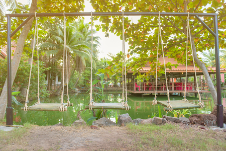Vintage back yard with outdoor seating.beautiful garden house in country.の写真素材
