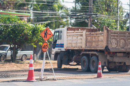 Road closed signs detour traffic temporary due to the construction of roads.