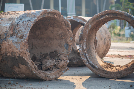 Old sewage drainage pipes or old concrete pipes that have been worn out on the ground Waiting for maintenance.の写真素材