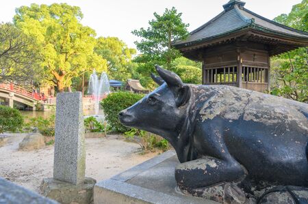 Fukuoka, JAPAN - 15 October 2019 :Brass statue of the legendary ox in Dazaifu Tenmangu shrine, one of the most well-known Shinto shrines in Japan.のeditorial素材