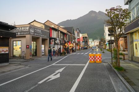 Yufuin, JAPAN - 14 October 2019 : Tourists walking along the main road in Yufuin, the touristic landmark on Kyushu Island in South of Japan.のeditorial素材