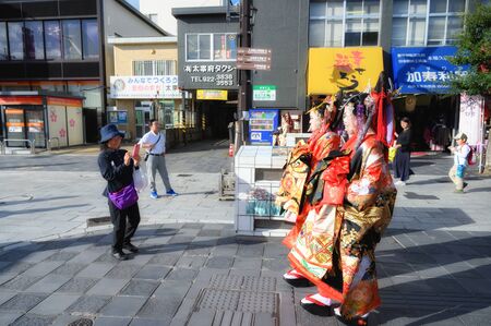 Fukuoka, JAPAN - 15 October 2019 : Japanese girls with kimonos suit (Yukata) to pay respect at Dazaifu Tenmangu Shrine, one of the most well-known Shinto shrines in Japan.のeditorial素材