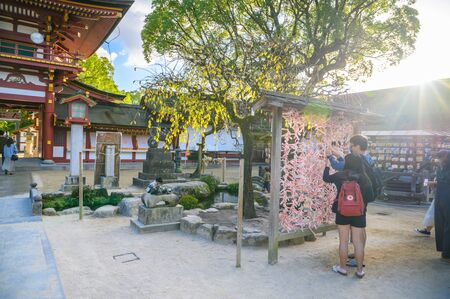 Fukuoka, JAPAN - 15 October 2019 : Tourists coming to pay respect at Dazaifu Tenmangu Shrine, one of the most well-known Shinto shrines in Japan.のeditorial素材