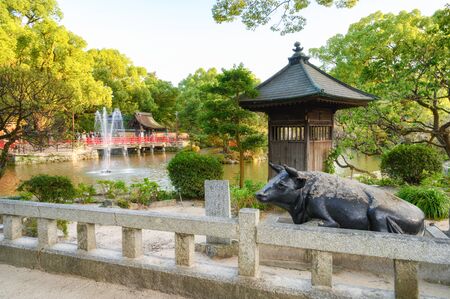 Fukuoka, JAPAN - 15 October 2019 :Brass statue of the legendary ox in Dazaifu Tenmangu shrine, one of the most well-known Shinto shrines in Japan.のeditorial素材