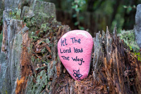 Let the Lord lead the way quote. Motivational religious message of faith. Pink pebble art in nature...