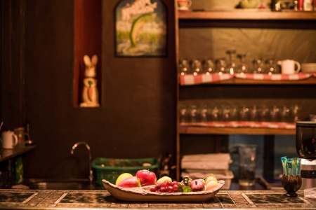 Still life with apples and fresh bread in vintage roomの写真素材