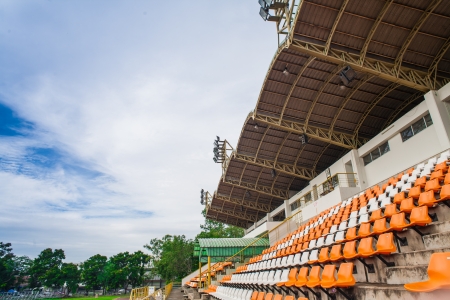 Stadium and seat with blue sky on roofの写真素材