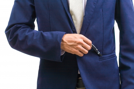 Business man pick a pen, isolated on whiteの写真素材