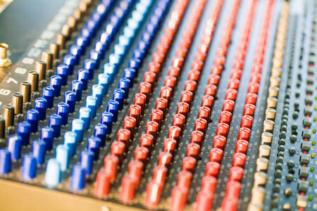 Close-up of music controls buttons of studio mixerの写真素材