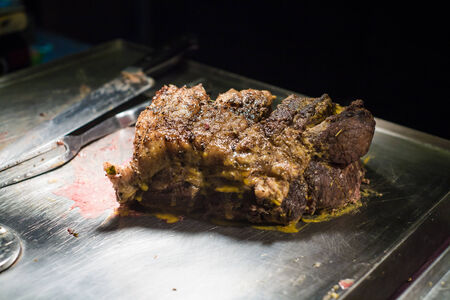 Delicious beef steak on table with knifeの写真素材