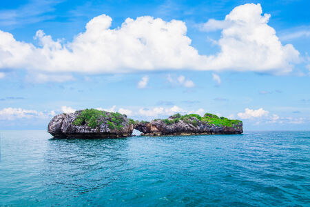 Small through island against blue sky, Seascape in Thailandの写真素材