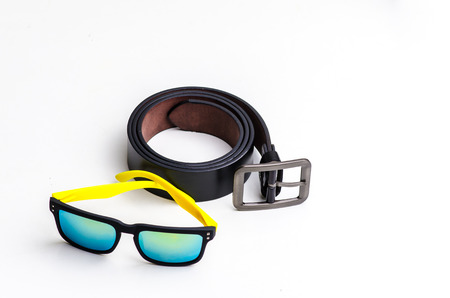 Black leather belt with sport glasses isolated on white background