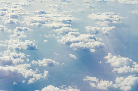 Blue sky with clouds, shot from an airplane. The upper layers of the atmosphere.