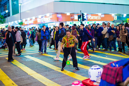 HONG KONG - DEC 6: People show on Mongkok street on December 6, 2014. Mongkok street is a very popular shopping place in Hong Kong.のeditorial素材