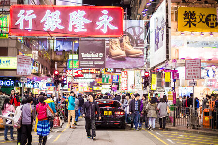 HONG KONG - DEC 6 : Mongkok at night on December 6, 2014 in Hong Kong. Mongkok is characterized by a mixture of old and new multi-story buildings. Mongkok is the busiest district in Hong Kong.のeditorial素材