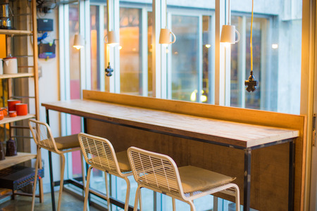 Modern restaurant interior, Empty table with chairの写真素材