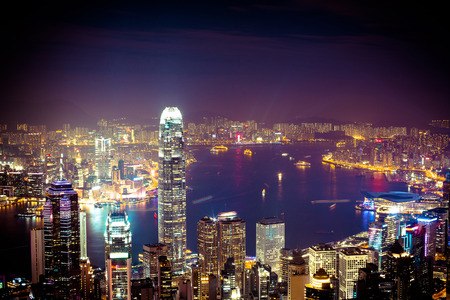 Office building at night in hong kong, Victoria harbourの写真素材