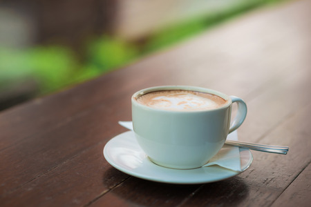 Coffee cup on wood table in coffee shop, Selective focusの写真素材