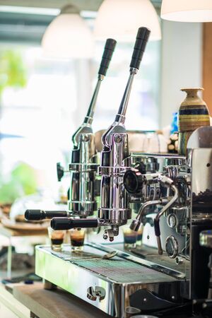 Prepares espresso in modern coffee shop, Coffee machineの写真素材