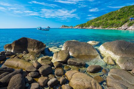 Rock beach and blue sky with beautiful clouds tropical sea,  Rocks at natural bayのeditorial素材