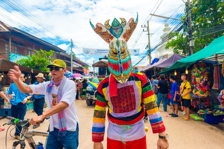 LOEI PROVINCE, THAILAND-JUNE 27: People  at Ghost Festival (Phi Ta Khon) Ghost masked procession celebrated on religious tradition "Boon Pra Wate" at Dan Sai district, Loei, June 27,2015.のeditorial素材