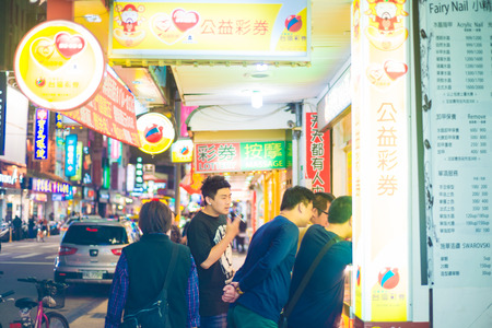 TAIPEI, TAIWAN - MARCH 21, 2015: Food vendors operate at a night Market on Guangzhou Street. Night markets are a popular part of Taiwanese culture.のeditorial素材