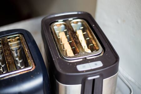 Modern design of the bread toaster with bread slicesの写真素材