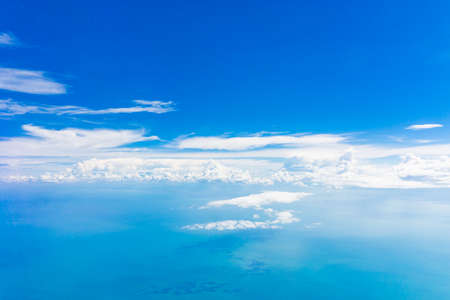 Blue sky background with tiny clouds. Blue sceneryの写真素材