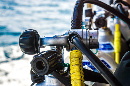 Scuba Diver equipment on boat with sea background, Close up on regulator and valveのeditorial素材