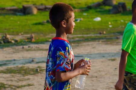 Sangkhlaburi, Thailand - May 4, 2014: Unidentified young asian Mon boy enjoying with friends at Old temple in Sangkhlaburi,Thailand.のeditorial素材