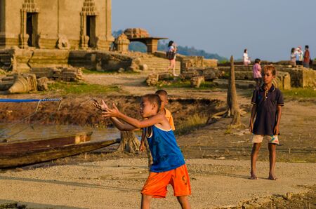 Sangkhlaburi, Thailand - May 4, 2014: Unidentified young asian Mon boy enjoying with friends at Old temple in Sangkhlaburi,Thailand.のeditorial素材