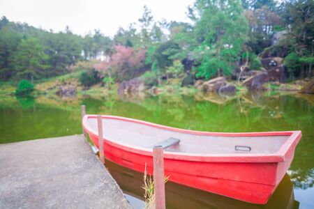 Nature scence on the lake with boat and trees wild himalayan の写真素材