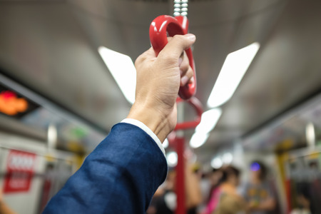 Business hand hold bus or train handle bar, Handrailsの写真素材