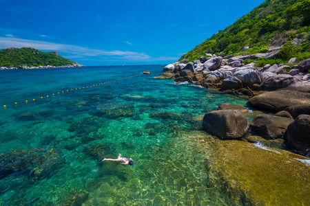 Woman swimming in the crystal sea, Koh Tao,Suratthani  Thailandの写真素材