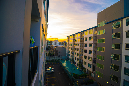 Modern condo residential buildings on afternoon with sun set