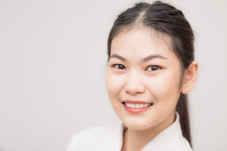 Smiling Asian Caucasian Business Woman. Clos up on faceの写真素材
