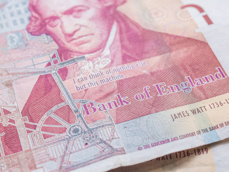 Detail of British Pounds banknotes money on wood table close upの写真素材